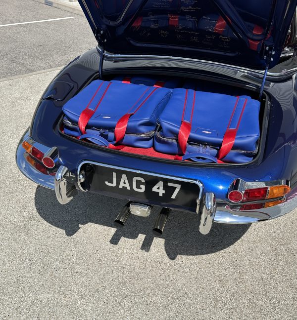 jaguar blue luggage in boot